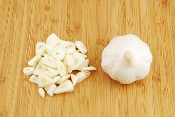 Image showing Garlic preparation ways on a cutting board