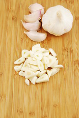 Image showing Garlic preparation ways on a cutting board