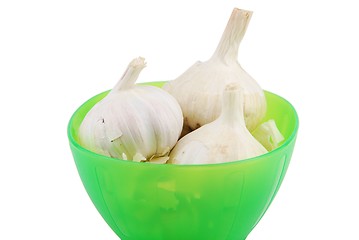 Image showing Green bowl of fresh garlic on white