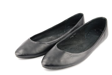 Image showing Lady black leather ballet flat shoes on white