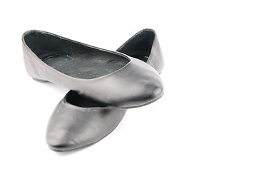 Image showing Lady black leather ballet flat shoes on white