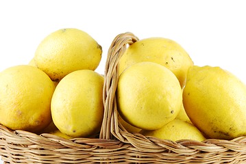 Image showing Close-up of lemons in a wicker basket on white