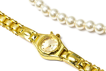 Image showing Golden wrist watch and pearl necklace