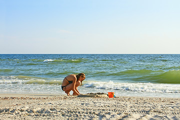 Image showing Teenage girl on an empty beach