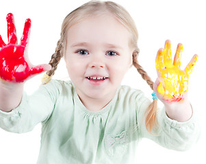 Image showing Little girl playing with colors