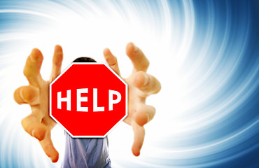 Image showing Man grabing a help sign.