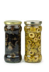 Image showing Glass jar with sliced green and black olives