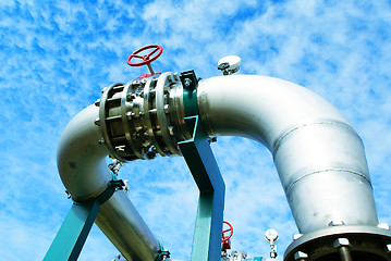 Image showing Industrial zone, Steel pipelines and valves against blue sky