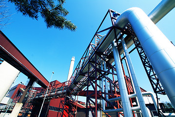 Image showing Industrial zone, Steel pipelines and valves against blue sky