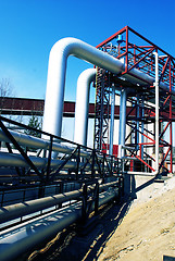 Image showing Industrial zone, Steel pipelines and valves against blue sky