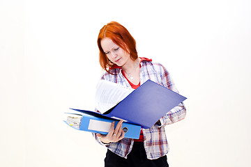 Image showing Redhead young woman with a folder