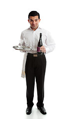 Image showing Smiling waiter or servant with wine and glasses