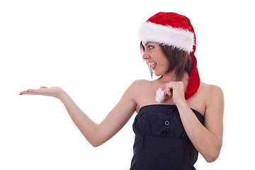 Image showing woman in Santa Cap holding something 