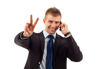 Image showing  man making victory sign on phone