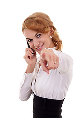 Image showing  woman on mobile phone pointing to you