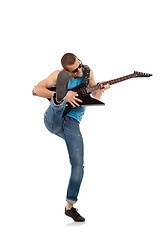 Image showing kicking guitarist 