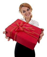 Image showing Business woman is giving a present 
