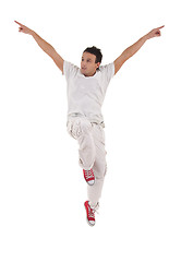 Image showing dancer with hands up jumps