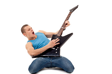 Image showing man playing a guitar