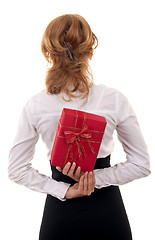 Image showing woman holding a present on her back 