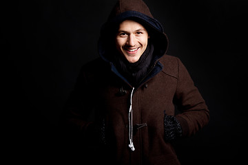 Image showing fashion male portrait with a hodded coat