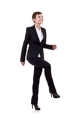 Image showing woman stepping on imaginary step