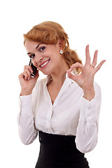 Image showing  woman with phone and ok gesture