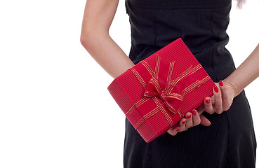 Image showing woman holding a present on her back 