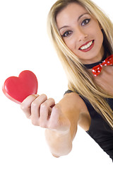 Image showing  woman holding a big red heart and smiling