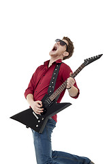 Image showing Guitarist screaming and jumping
