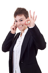 Image showing  woman with phone making ok