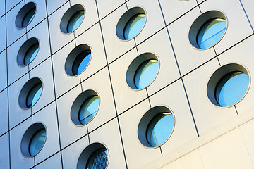 Image showing Windows of modern building toned in blue color 