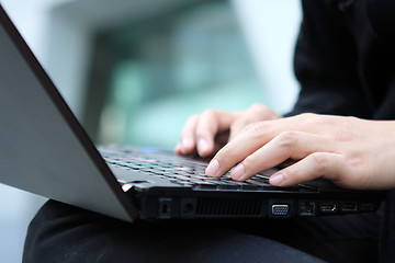 Image showing young man works for a laptop 