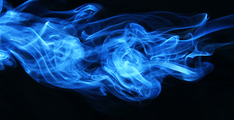 Image showing Stream of a blue smoke on a black background 