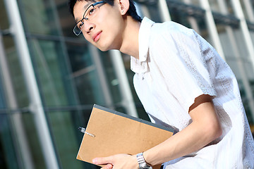 Image showing young man studying at outdoor