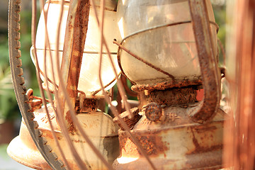 Image showing rust and brocken kerosene lamp 