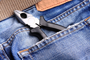 Image showing pliers in the jeans' pocket