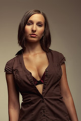 Image showing attractive girl in brown shirt