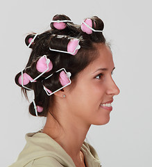 Image showing Woman with hair curlers