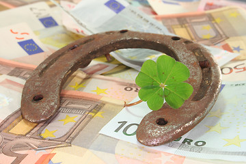 Image showing Horseshoe with clover and Euro