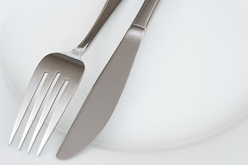 Image showing Closeup of fork and knife on a plate