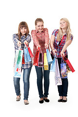 Image showing Three girls with colorful shopping bags