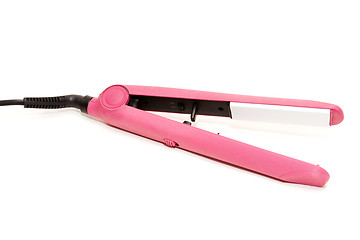 Image showing Electric pink hair straightener