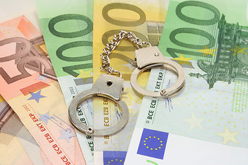 Image showing handcuffs on euro notes