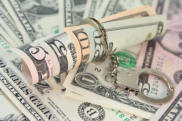 Image showing Dollar bills with handcuffs