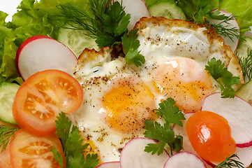 Image showing Chicken eggs with greens macro isolated