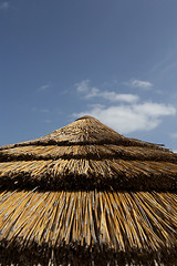 Image showing Top of straw parasol