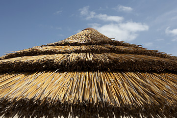 Image showing Top of straw parasol