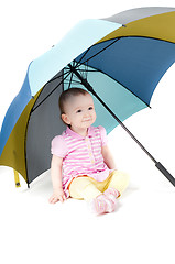 Image showing Cute baby girl under umbrella