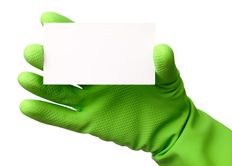 Image showing Hand in green glove showing business card